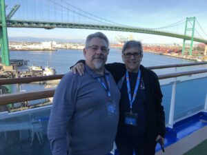 Keith & Ilene standing by the ship's rail with a bridge behind us